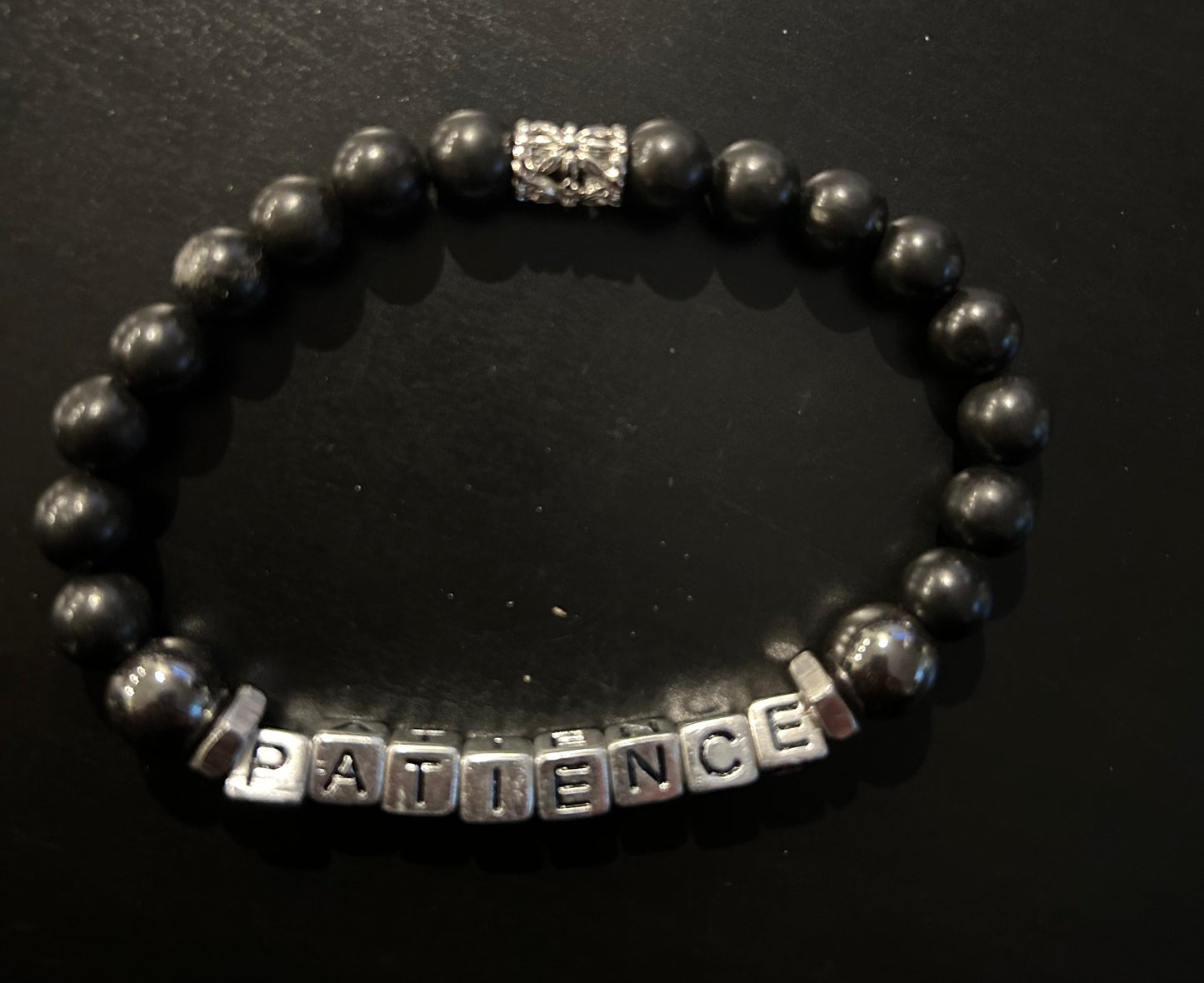 Black & Silver Letters “Patience”