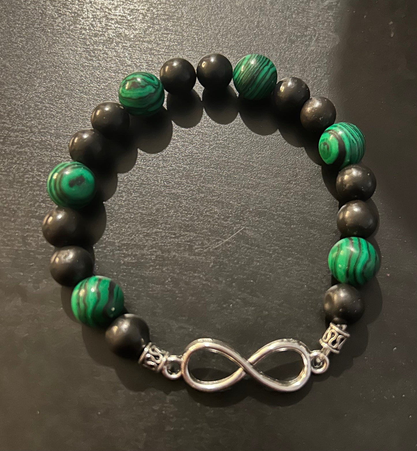 Black matte/hunter green swirled stones w silver metal infinity