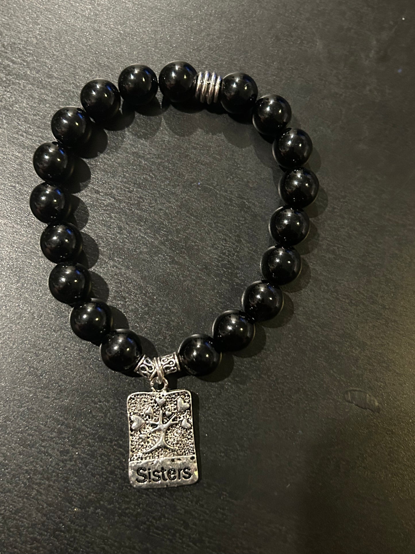 Black stones w/Silver metal “Sisters”