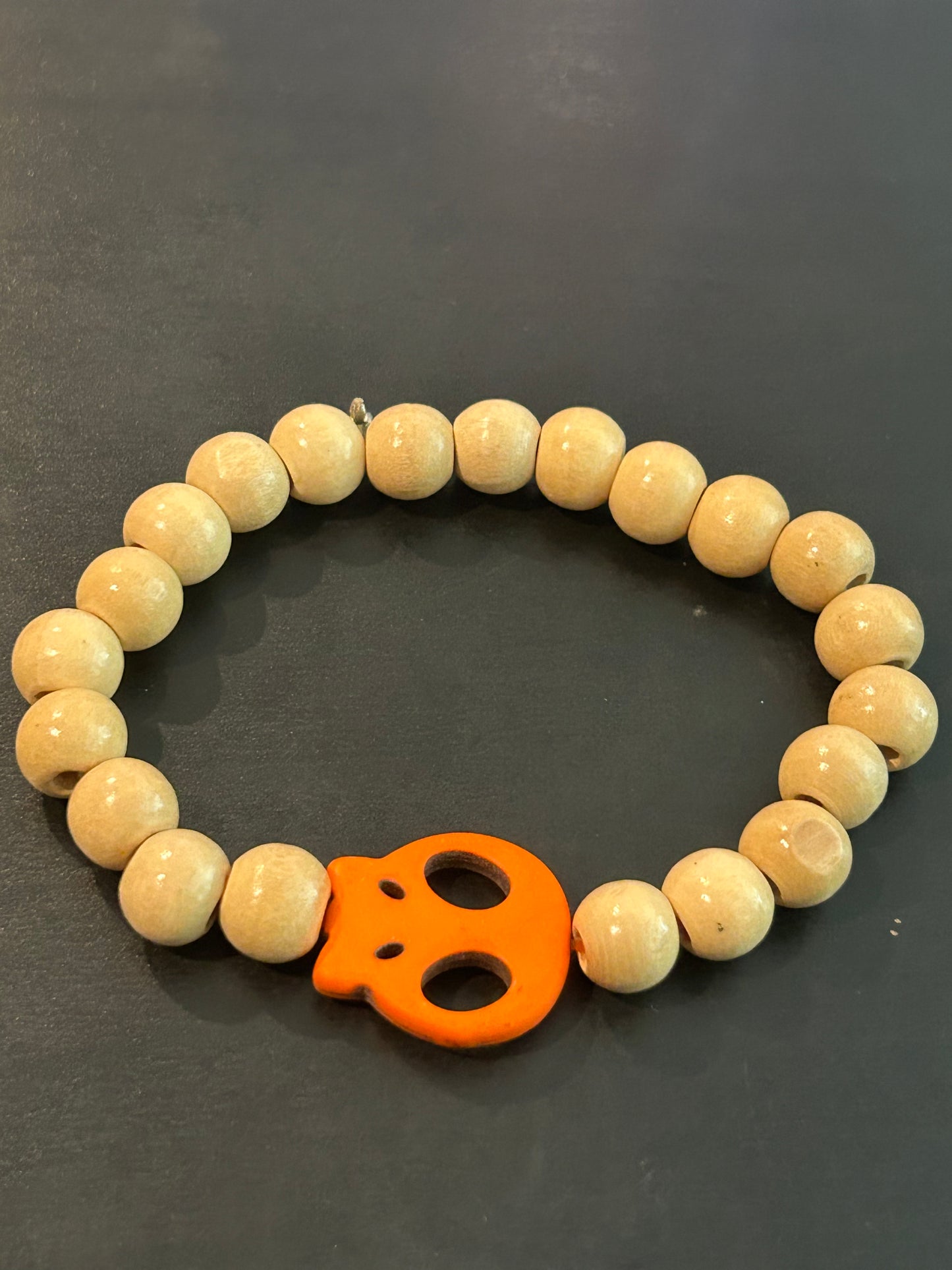 Light maple wood beads w/tangerine flat skull