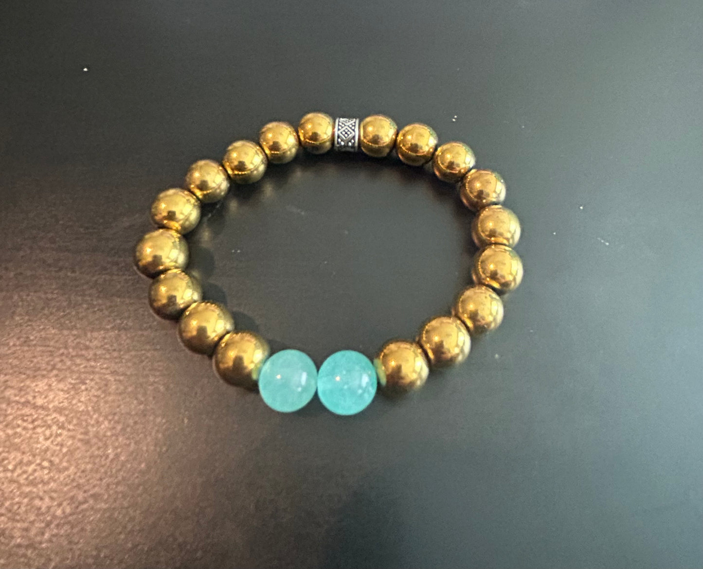 Gold metal beads w/baby blue gemstones