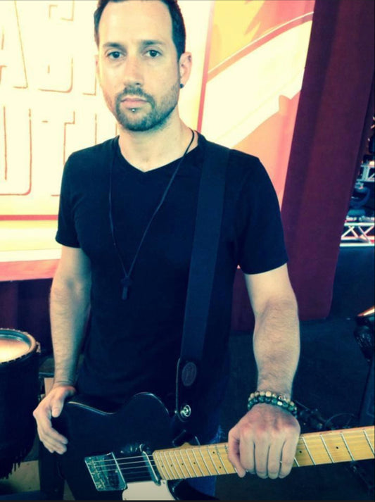 “Smash Mouth” leas guitarist, Sean wearing a variety of mens bracelets & metal medallion necklace on tour w/SM & Enrique Inglesias