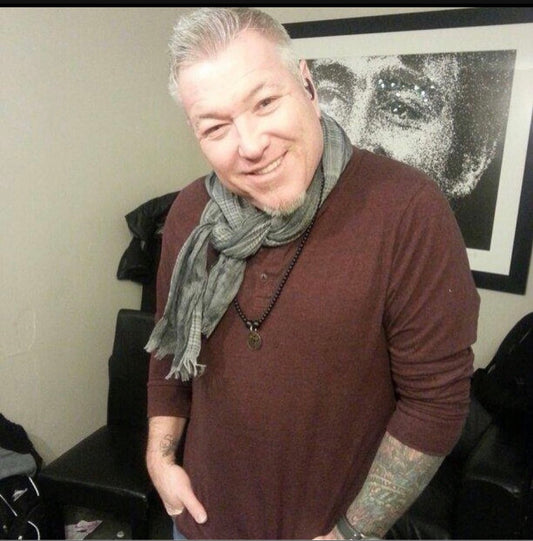 “Steven Harwell” Former lead singer “Smash Mouth” wearing blk matte stones w/dagger bronze metal medallion necklace (Rip)