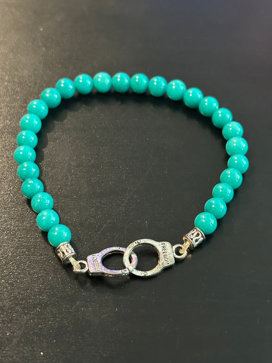 Turquoise blue w/metal handcuffs